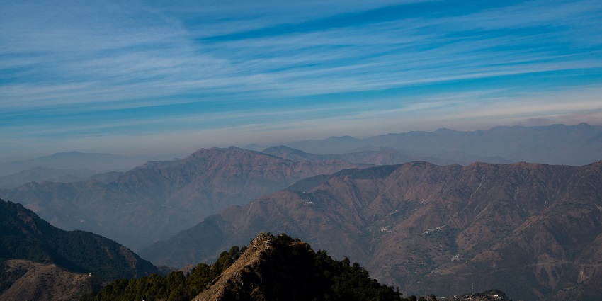 One of the places to visit near Mussoorie in May feature Dalai Hills with stunning views