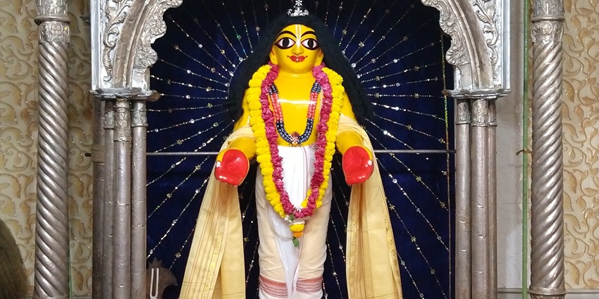 A picture of the inner prayer sanctum of a temple in Nabadwip with a decorated idol in front