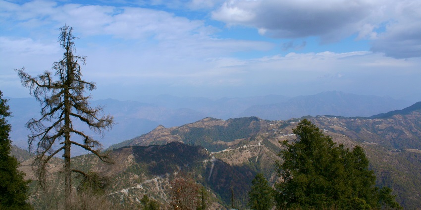 An image showing a panoramic view from Dhanaulti, highlighting the natural beauty of the region.