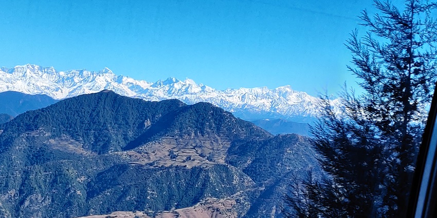 Image showing a breathtaking view from Dhanaulti, capturing the serene mountain landscape.