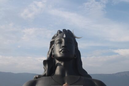 Dhyanalinga Temple, the huge structure of lord shiva at Isha Yoga Center and the area filled with people.