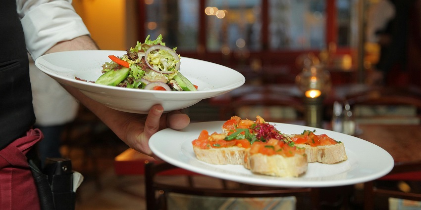 An image of food on white ceramic plates, one of the best things to do in DLF mall of India.