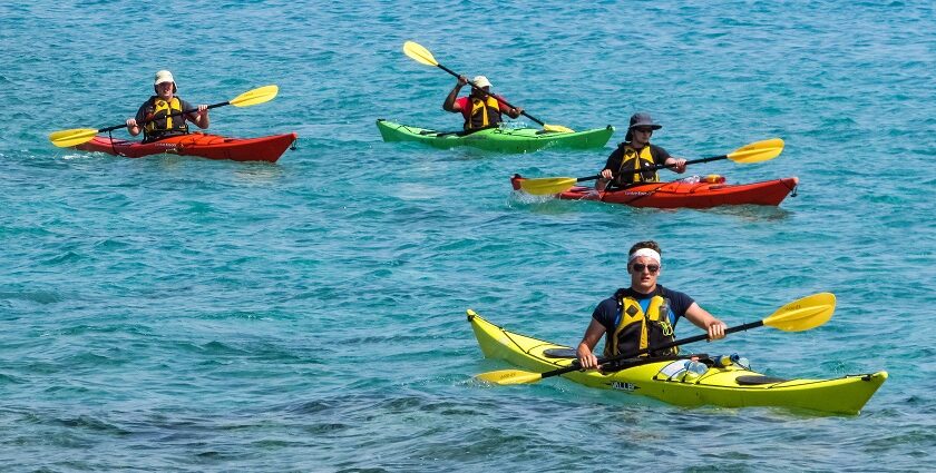 Image of tourists kayaking amidst the serene waters, one of the Diveagar beach water sports