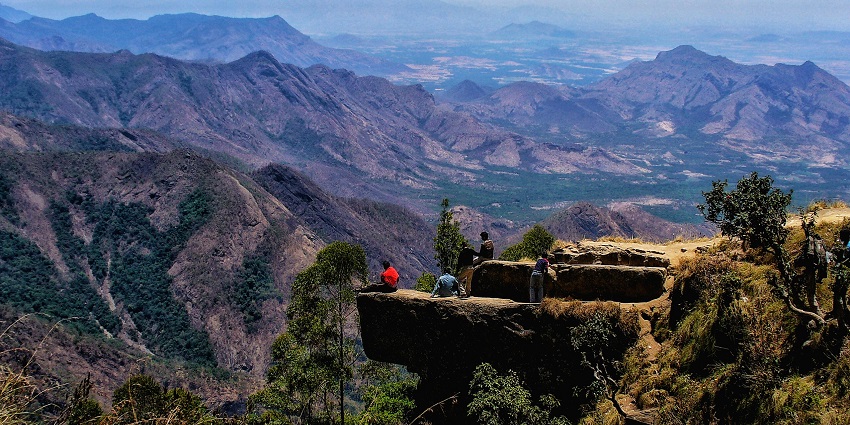 View of Dolphin Nose view point in Kodaikanal with thick green hills and a clear sky