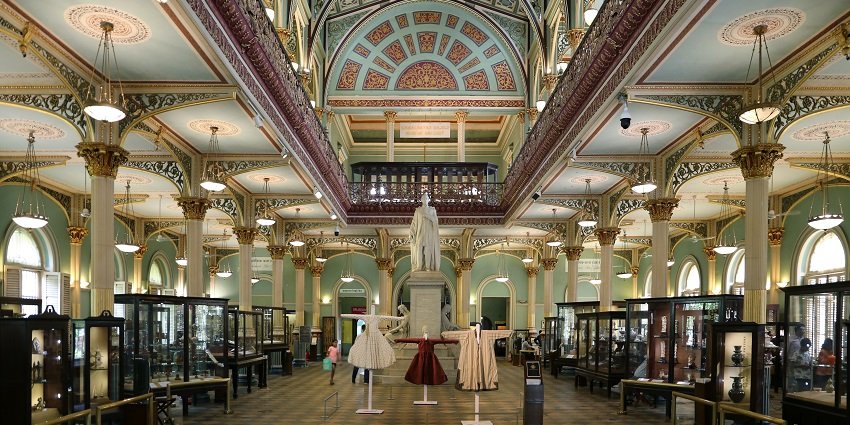Interior view of Dr. Bhau Daji Lad Museum, showcasing ornate architecture and exhibits.