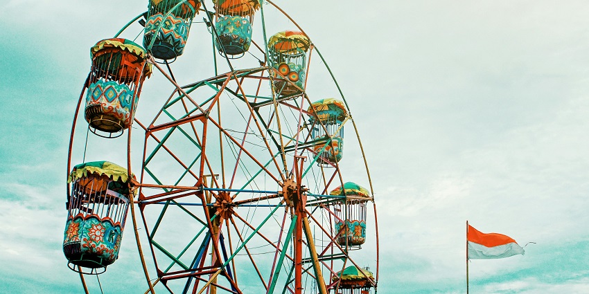 An image showing a ferris wheel, inside the Dream World amusement park