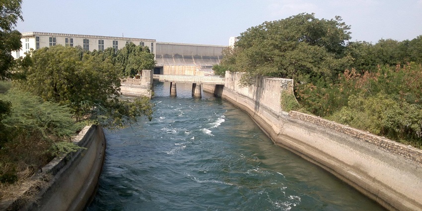 An image of Drona Sagar, a tranquil water body surrounded by natural beauty and scenic trails.