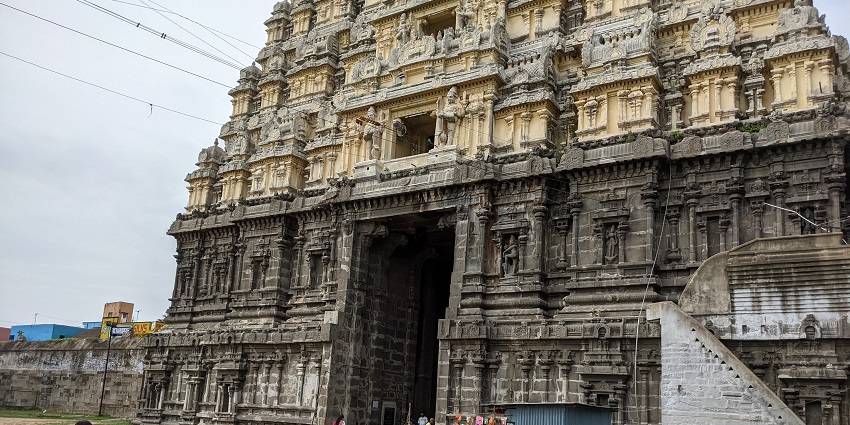 Ekambareswarar temple entrance with detailed architecture and people entering the temple