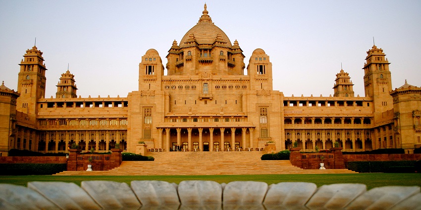 An image of Kanak Bhawan Temple, an intricately carved golden dome with an ornate interior.