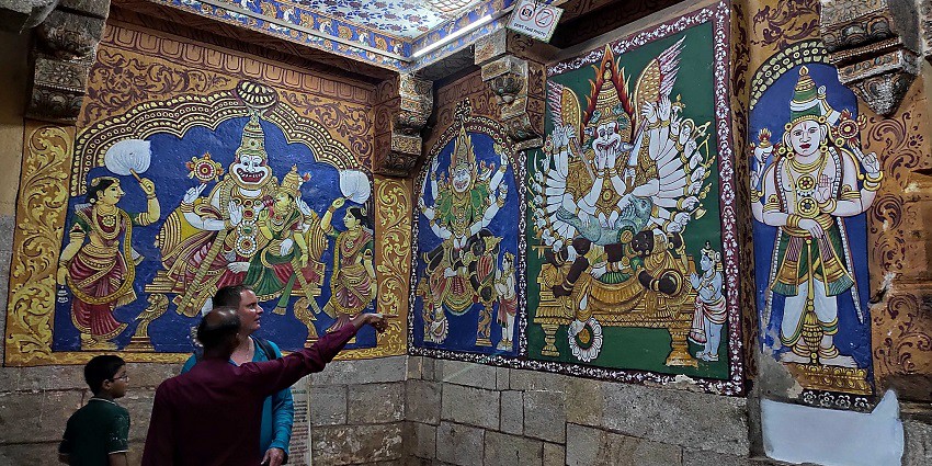 The interior architecture of Ranganathaswamy Temple and people exploring the insides.