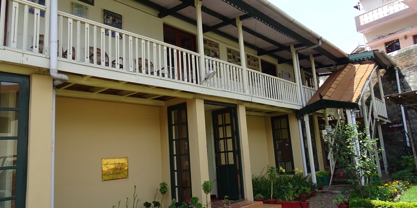 An image of the outer architecture of the Ooty Honey & Bee Museum in Ooty, India