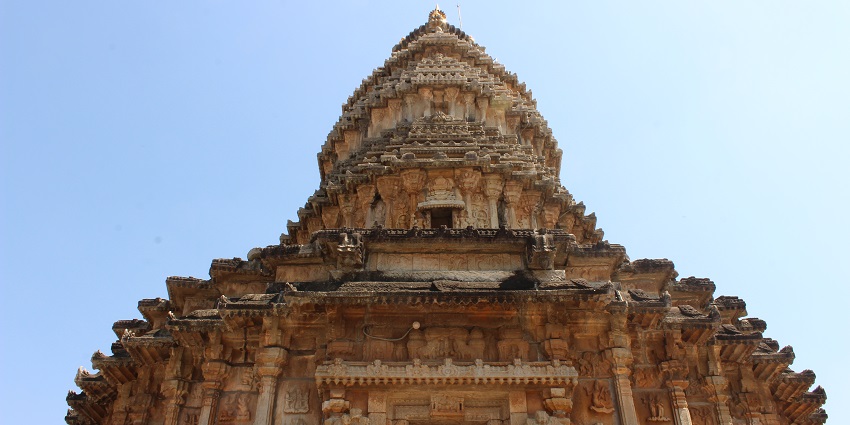 Dravidian architecture of a temple with intricate carvings and grand structures