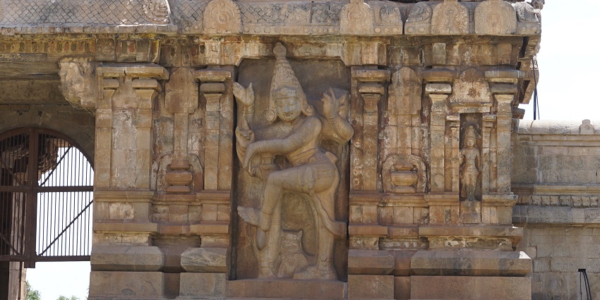 Detailed architecture of Peruvudaiyar Temple with intricate stone carvings and design.