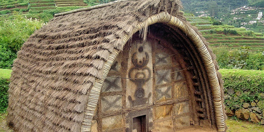 Exploring a tribal hut at Ooty Tribal Research Centre, one of the top things to do in Ooty.