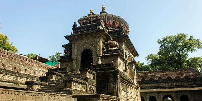 A picture of an ancient Hindu temple with traditional architecture