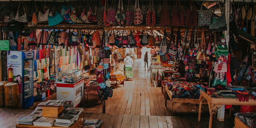 Image of tradinial handcrafted items hanging inside a shop for sale - explore the local markets