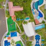 Aerial view of Fantasy World Water Park showing water slides, pools, and greenery