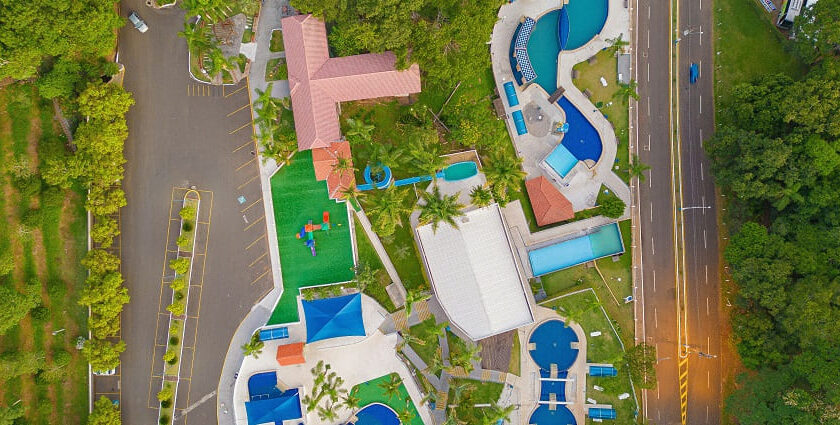 Aerial view of Fantasy World Water Park showing water slides, pools, and greenery