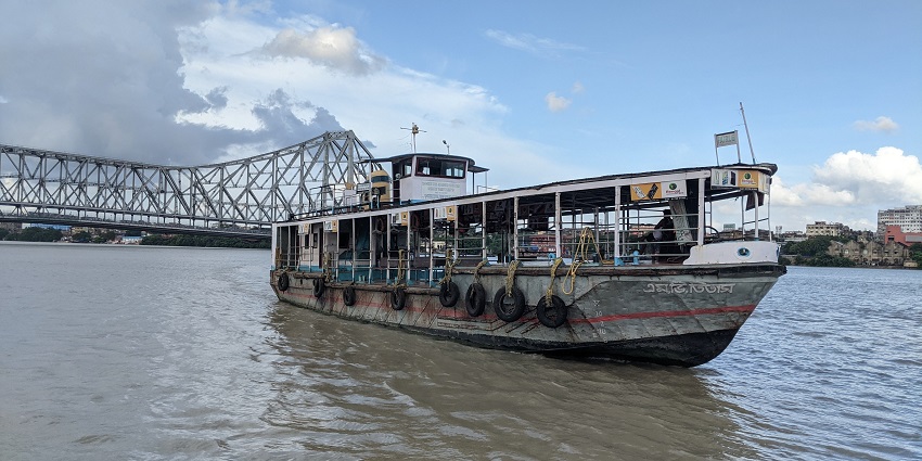 Taking a ferry ride near Howrah Bridge - one of the best fun things to do in Kolkata.