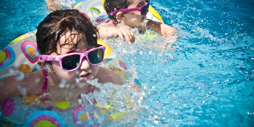 A view of Ffort Raichak Pool Area is filled with unique water slides and other activities.