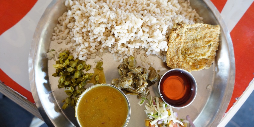 Goan typical meal with fish, curry and rice, one of the best food in Candolim.