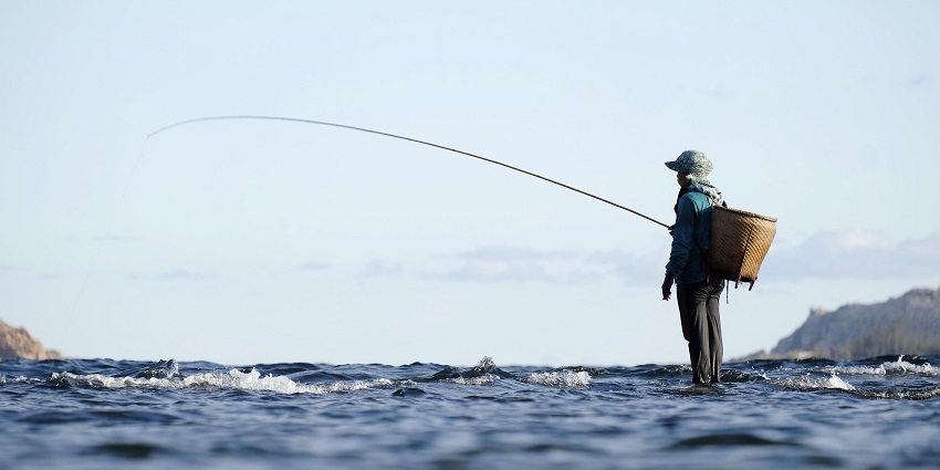 An image depicting fishermen enjoying fishing along scenic spots