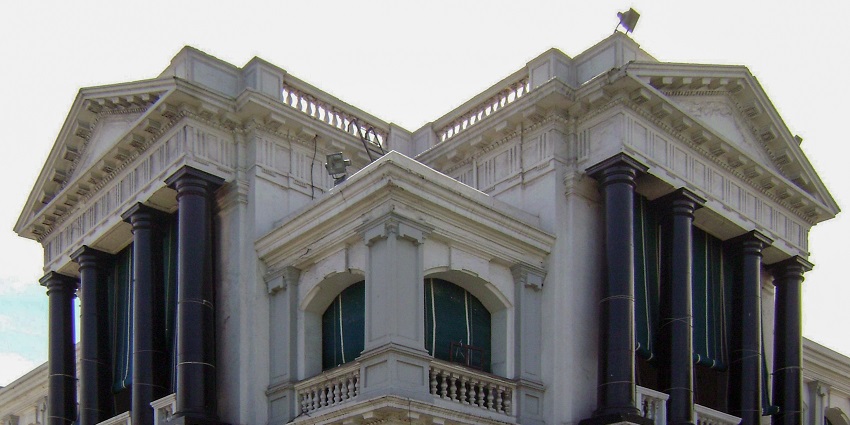 A frontal view of a traditional Catholic fort in Chennai with white exteriors and a royal finish