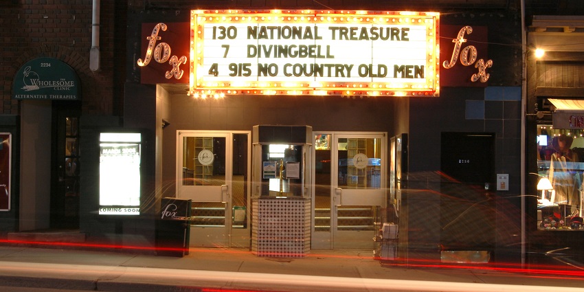 Fox Theatre marquee displaying the show names and timings on a brightly lit board