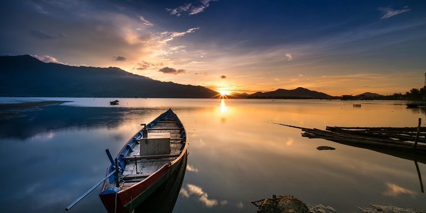 A view of boating activities on Futala Lake during sunset