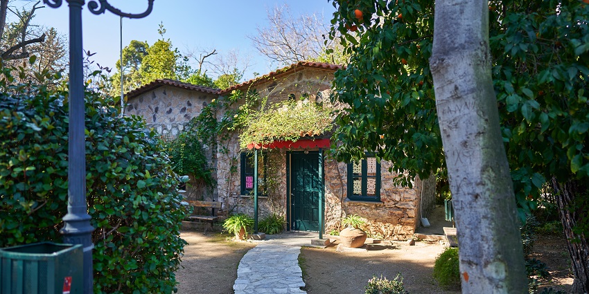 Entrance to children’s library at the National Garden of Athens with green surroundings.