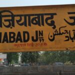 The image shows the Ghaziabad railway station board featuring the station's name.