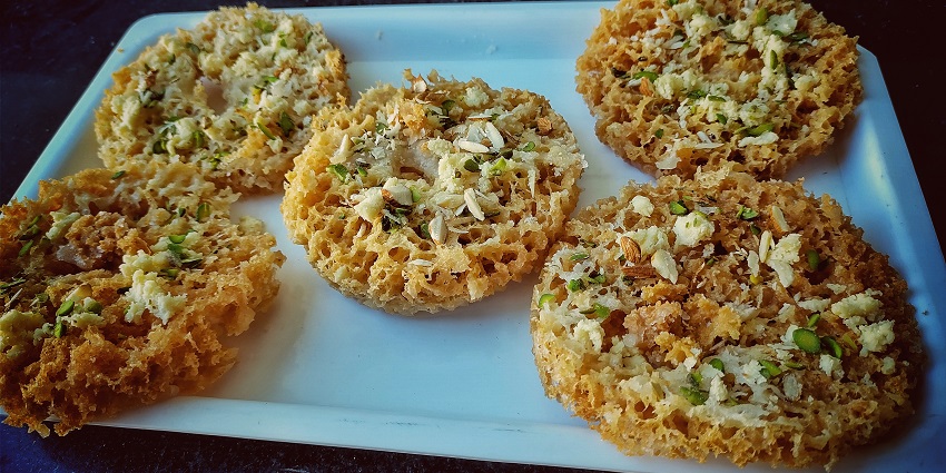An image of Ghewar is a sweet Indian dessert specially prepared during Raksha Bandhan.