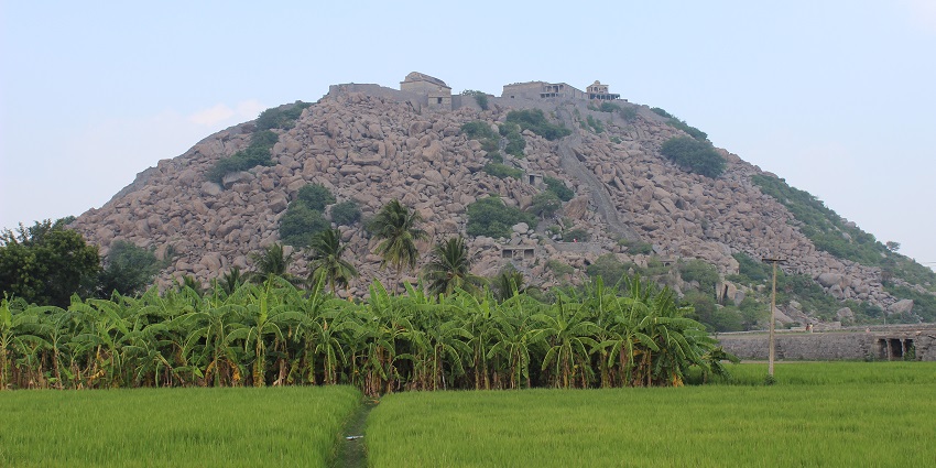 View of Gingee Fort from the road, showing the fort's hilltop structure in Tamil Nadu.