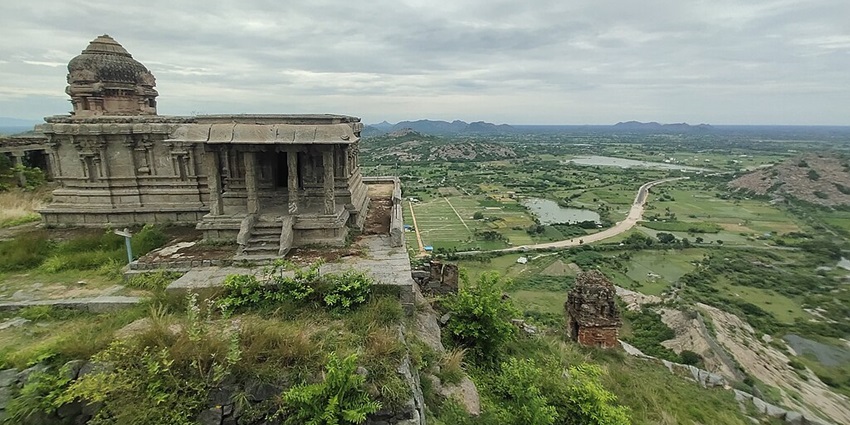 Gingee Fort, a historical fort built on top of scenic hills, surrounded by lush greenery.