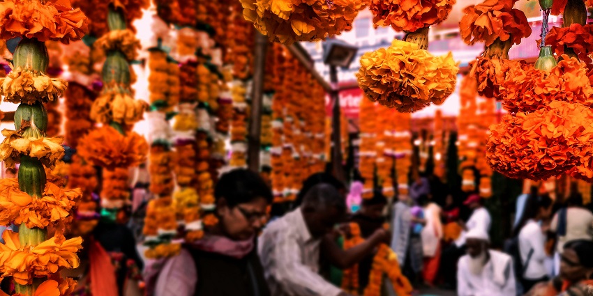 Vibrant street shopping in Varanasi with Banarasi silk, jewelry, and street food delights.