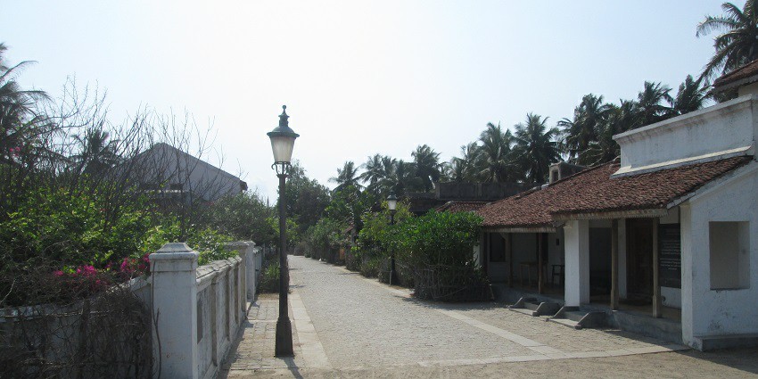Image of charming street lined with traditional shops and local crafts