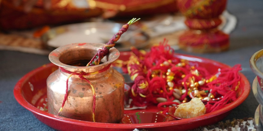 Image of a pooja thali decorated with threads - Krishna temple in Tamil Nadu.