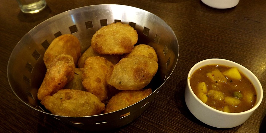 A delicous plate of Heeng Kachori, one of the items on your best food in Vrindavan list for spicy food lovers.