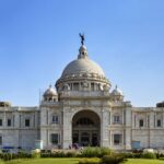 The popular Victoria Memorial monument in Kolkata with lush garden in front