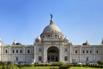 The popular Victoria Memorial monument in Kolkata with lush garden in front