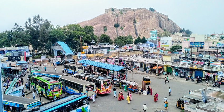Namakkal Bus Stand from above with buses parked and passengers roaming in the area.