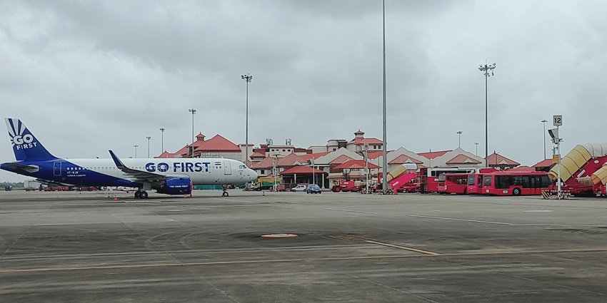 An aerial view of Cochin International Airport with runways and green surroundings.