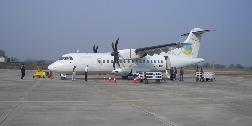 View of Kanpur Airport, showcasing the terminal building and aircraft on the tarmac