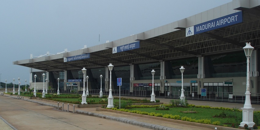 An image of the exterior view of the Madurai Airport terminal building showcasing modern architecture and design