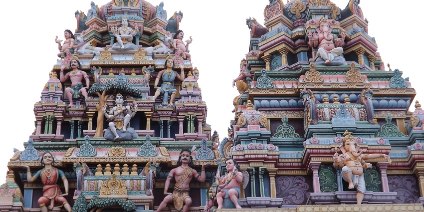A distant view of the temple gopuram, with intricate carvings