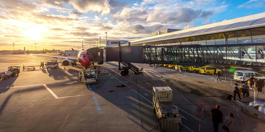 Image of an airport - showcasing the terminal building and surrounding landscape