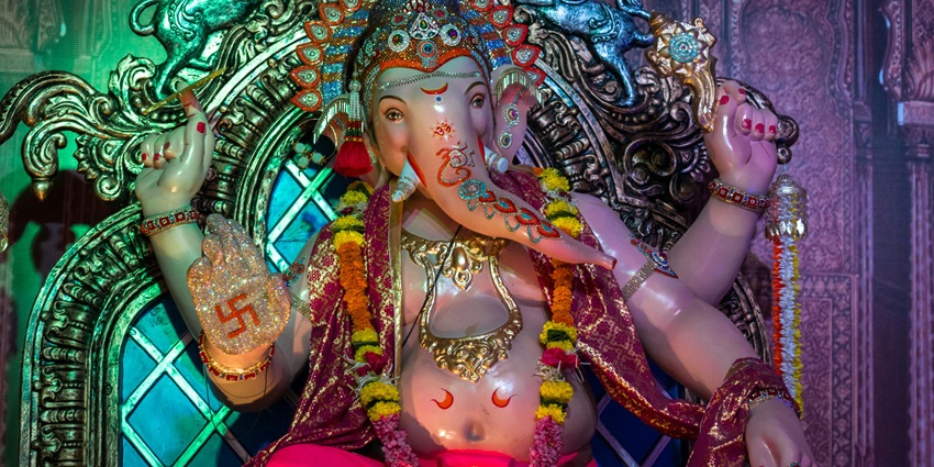 A picture of a Pandal in a temple with the idol of Lord Ganesha placed for worshipping