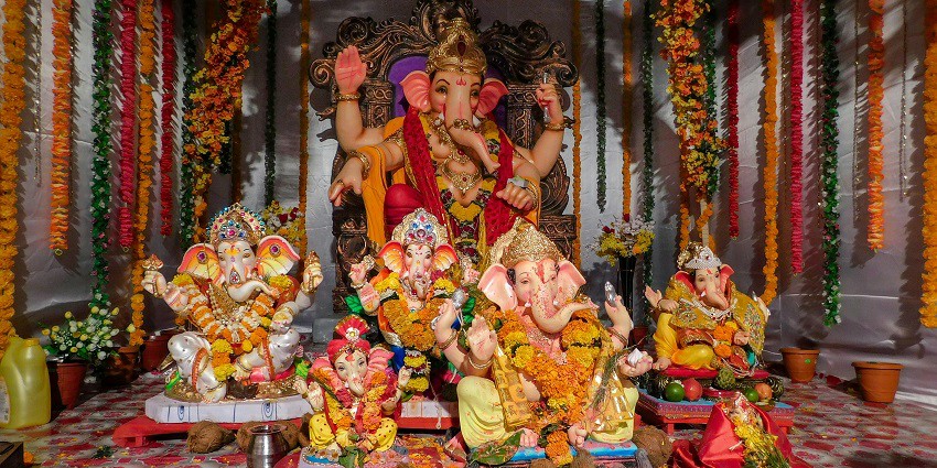 Image of Ganesha idols in the Adasa temple, ideal for devotees to pray and seek blessings