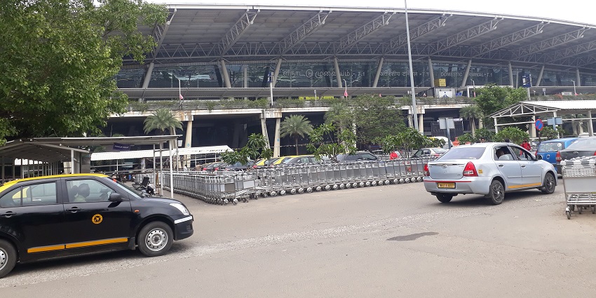 A panoramic view of Chennai Airport runway with planes and surrounding airport facilities