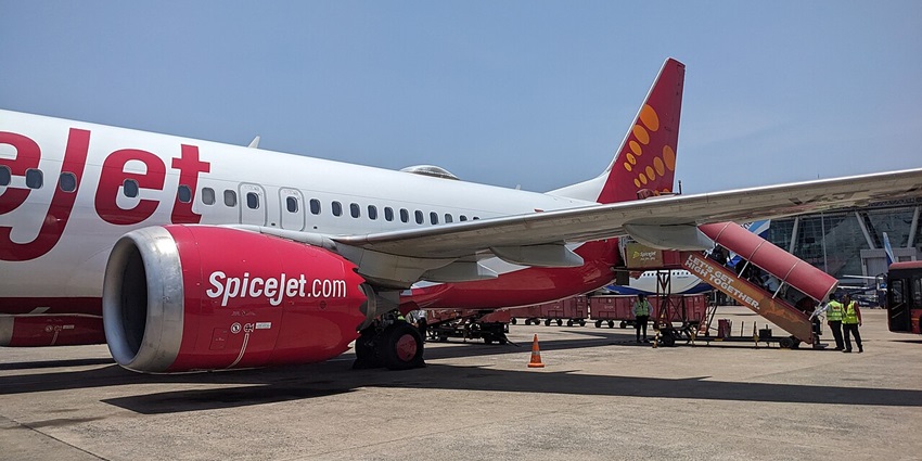 A panoramic view of Chennai Airport runway with planes and surrounding airport facilities.